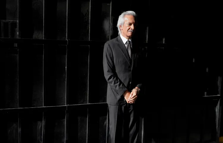 Guatemala's José Rubén Zamora, founder of El Periodico newspaper, waits in handcuffs ahead of a court hearing in Guatemala City on August 26.