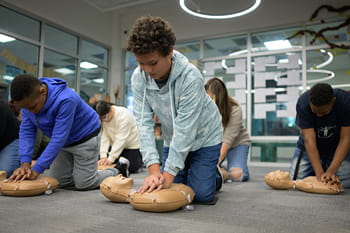 students learning CPR