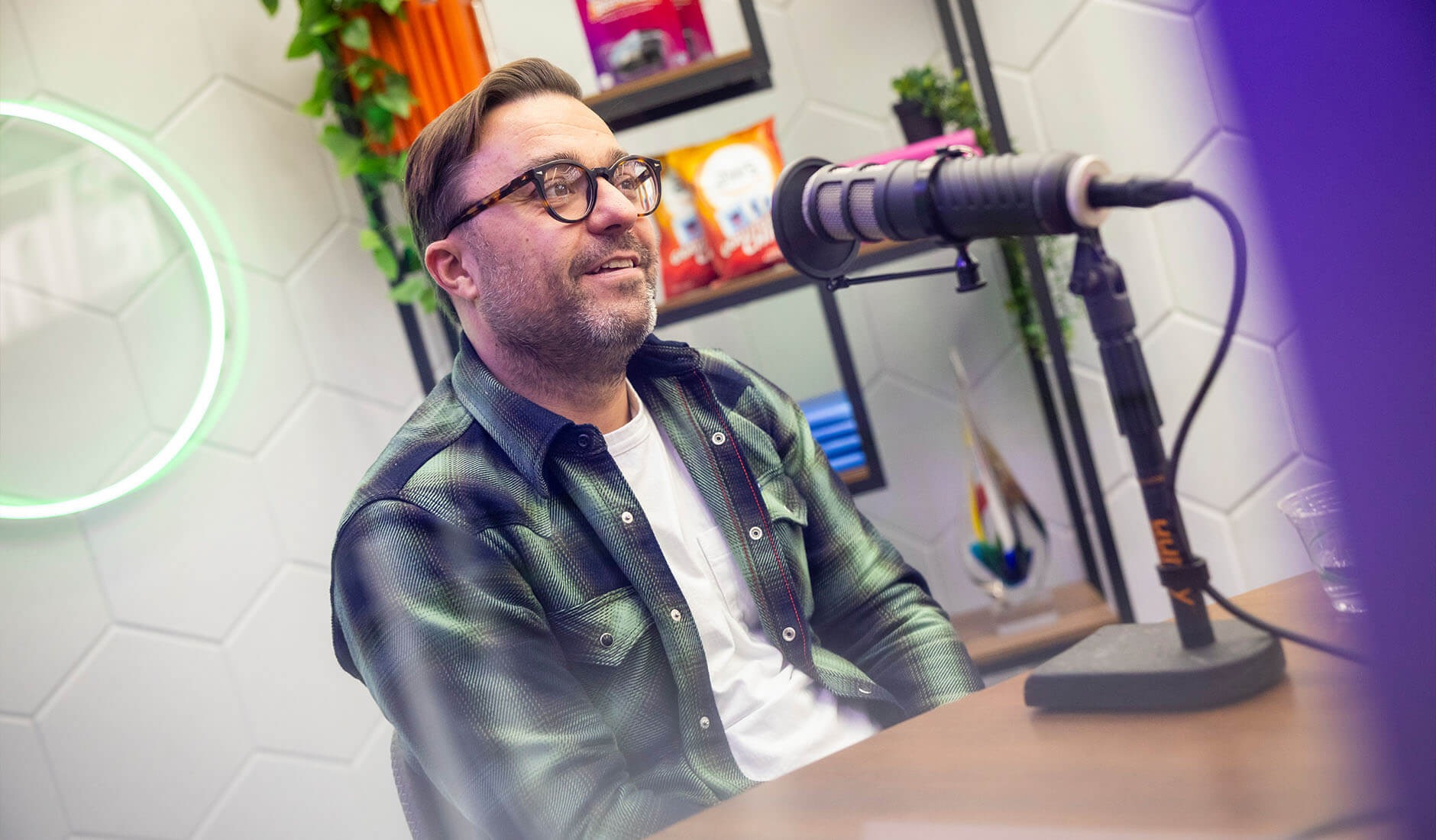 men in front of the microphone recording a podcast