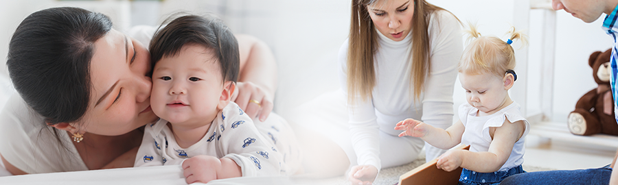 mother with baby; toddler girl with hearing aide