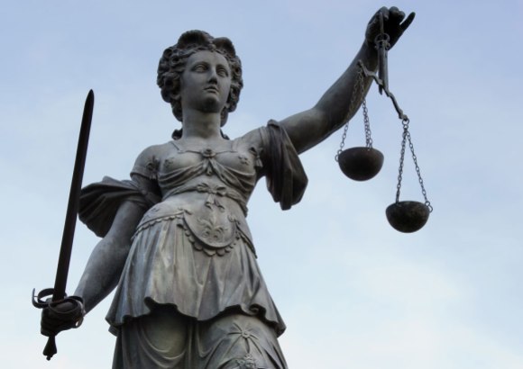 Photo of Lady Justice by Roland Meinecke, licensed under Free Art license.