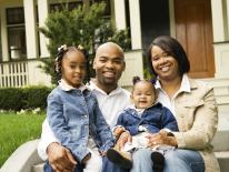 Photo of family sitting in front yard