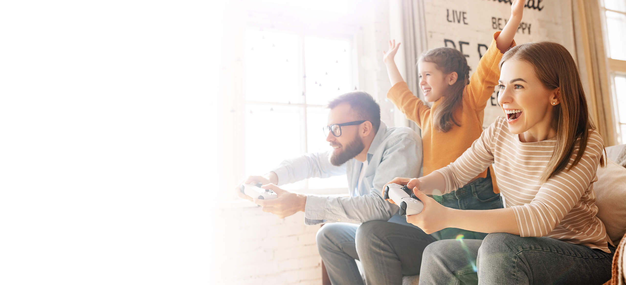 A happy family playing console