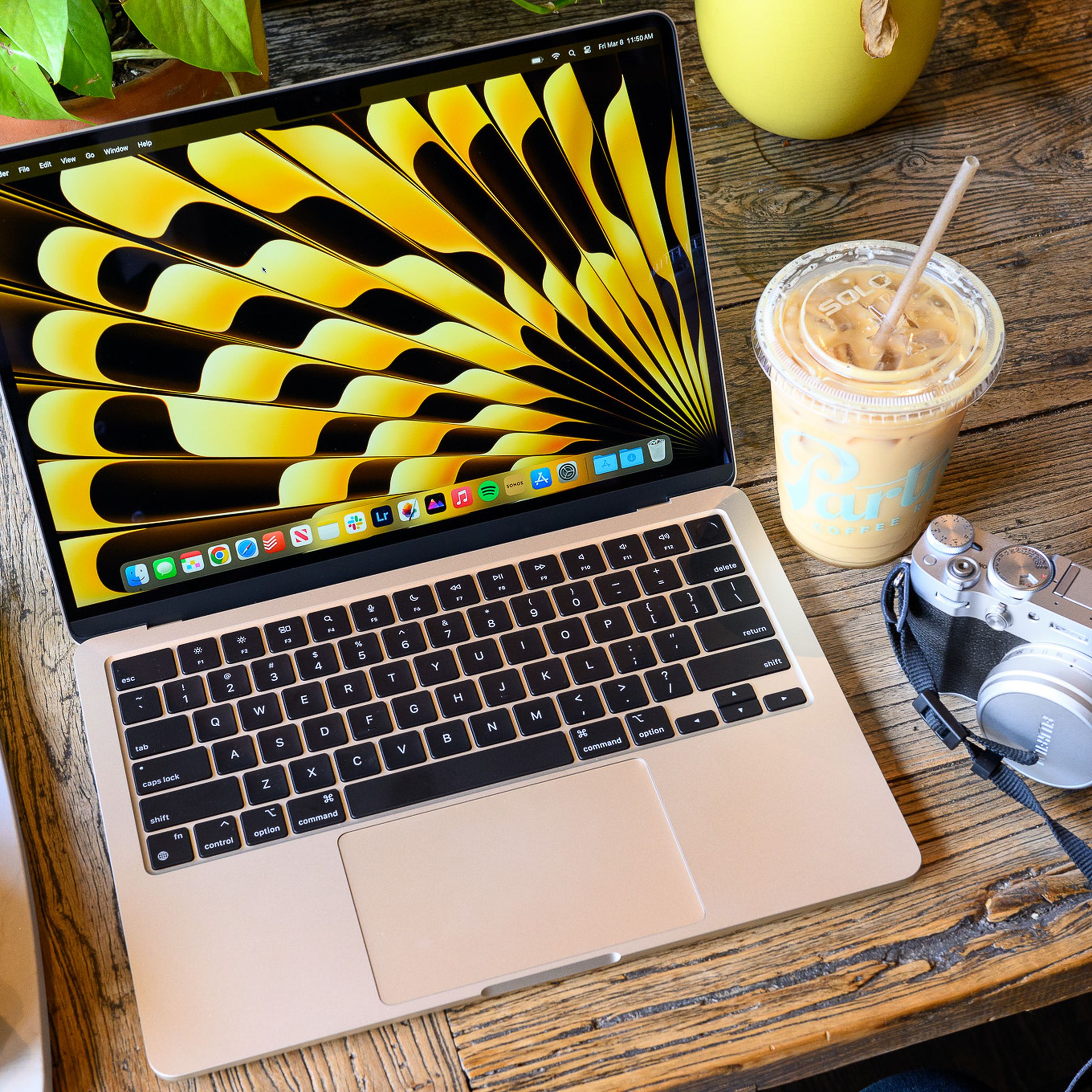 A photo of Apple’s M3-powered MacBook Air being used at a coffee shop.