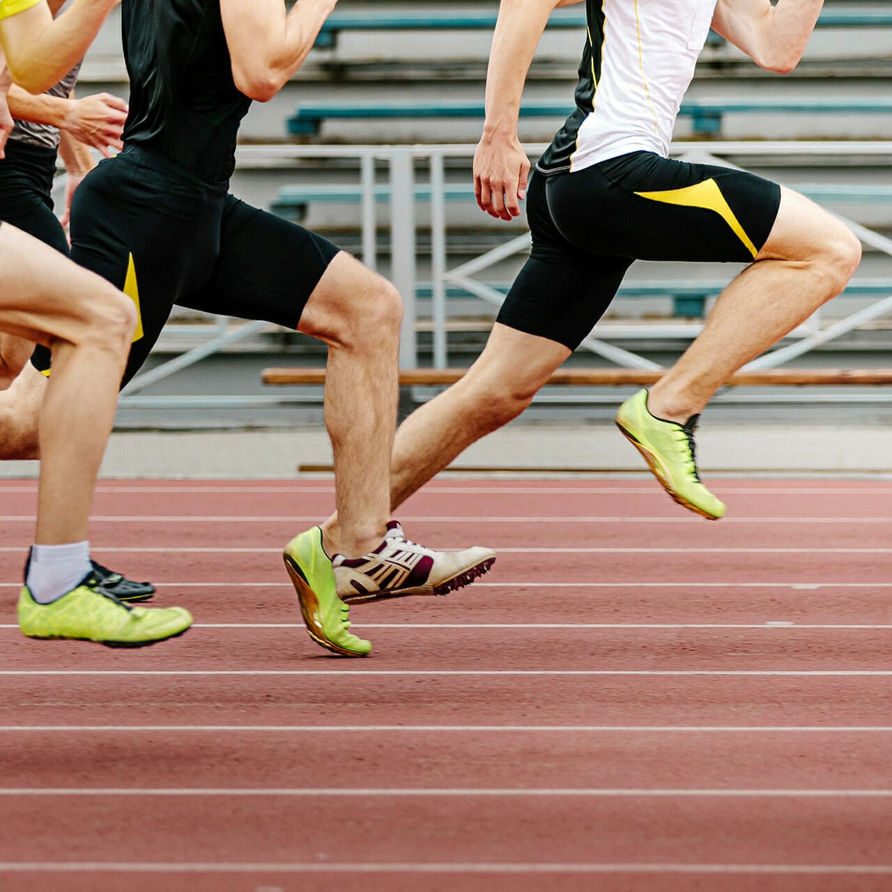 Runners sprinting on a track during a race, focused on their lower bodies in mid-stride, each vying for their moment as MVP.