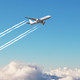 Plane at grey and blue sky background