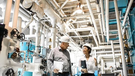 engineers pointing at cooling tower