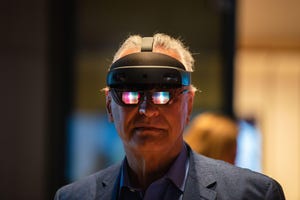 Bavarian Minister of the Interior Joachim Herrmann wears Hololens 2