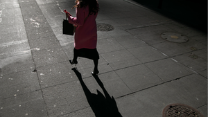 businesswoman walking on a sidewalk