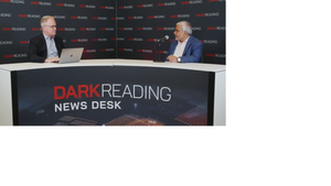 Two people talking at a news desk against a dark backdrop with "Dark Reading" written on it.