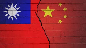 Flags of Taiwan and China on cinder block background