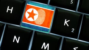  A keyboard with a North Korea flag key, with a fingerprint on the key