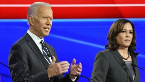 President Joe Biden speaking onstage beside VP Kamala Harris