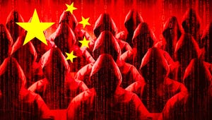 Anonymous hooded figures in several rows working on laptops with the Chinese red flag overlapping 