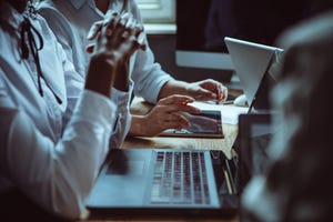 Office workers on laptops