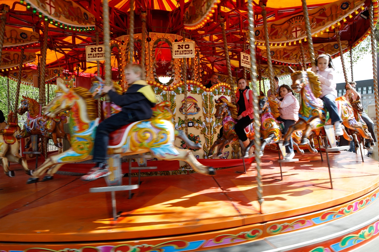 Child on a vintage merry-go-round horse