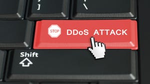 The words DDOS Attack on a red keyboard key