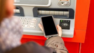 Individual transacting with ATM via NFC enabled phone