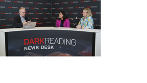 Two people talking at a news desk against a dark backdrop with "Dark Reading" written on it.