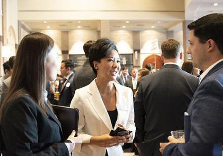 People networking in a large event hall