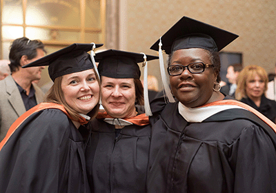 happy graduated in their caps and gowns