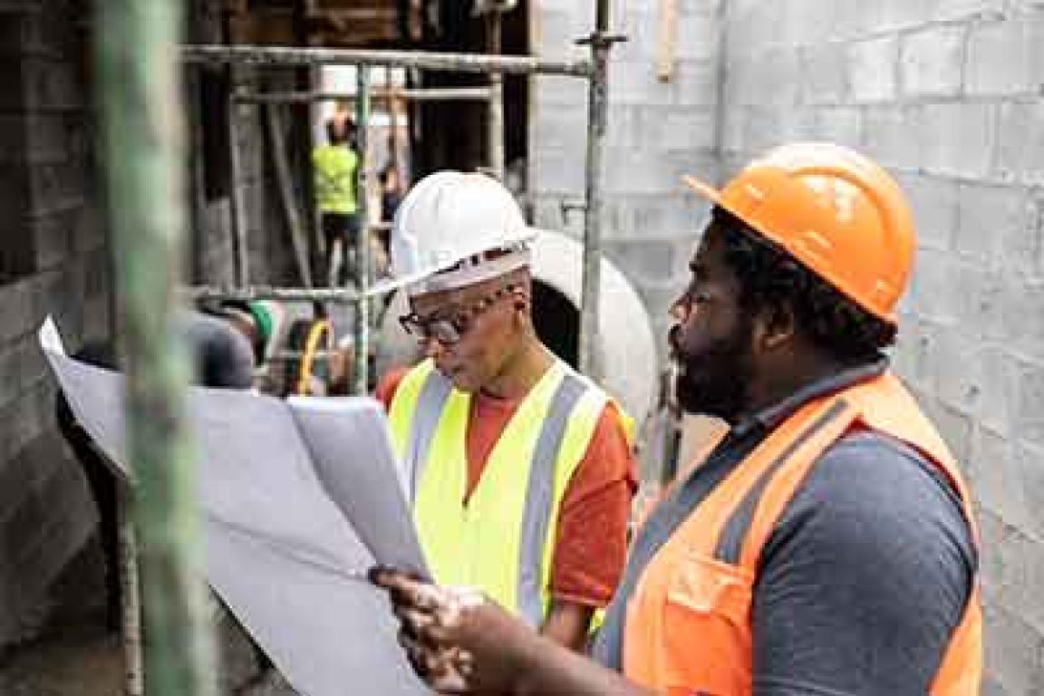 Construction workers looking at plans