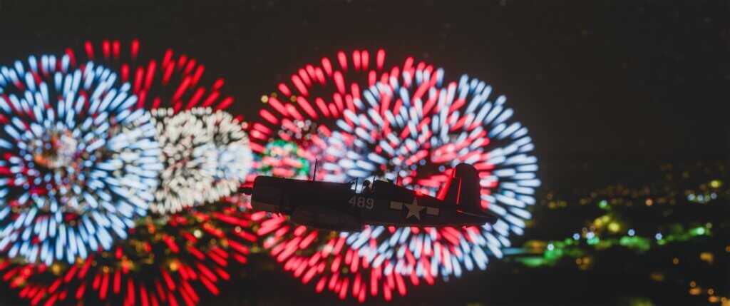 A low wing military aircraft climbs to avoid a shower of fireworks off of its right hand wing