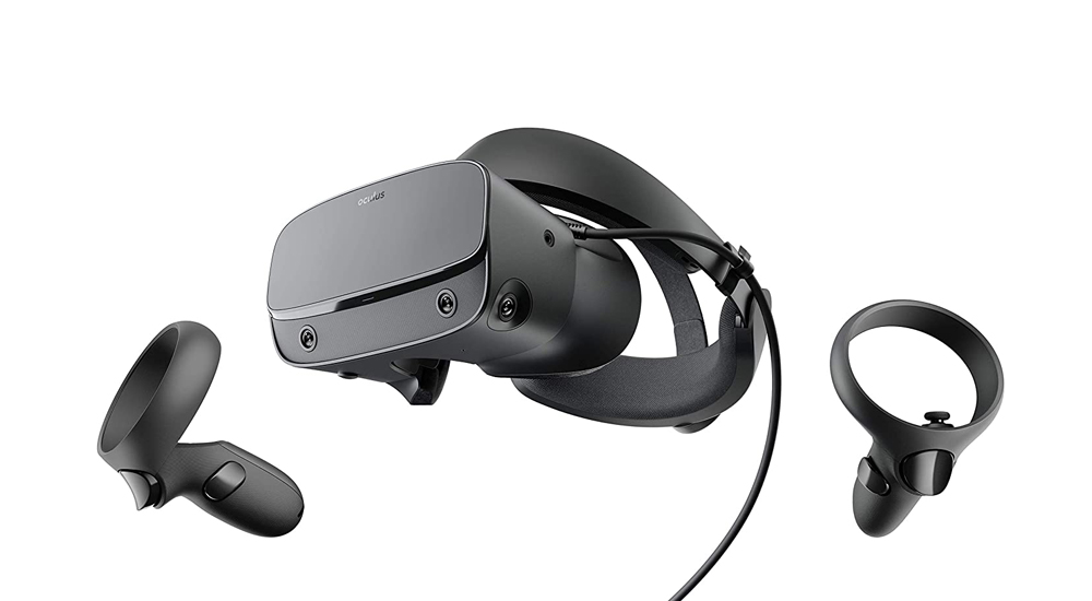 A tethered virtual reality headset with its two controllers.