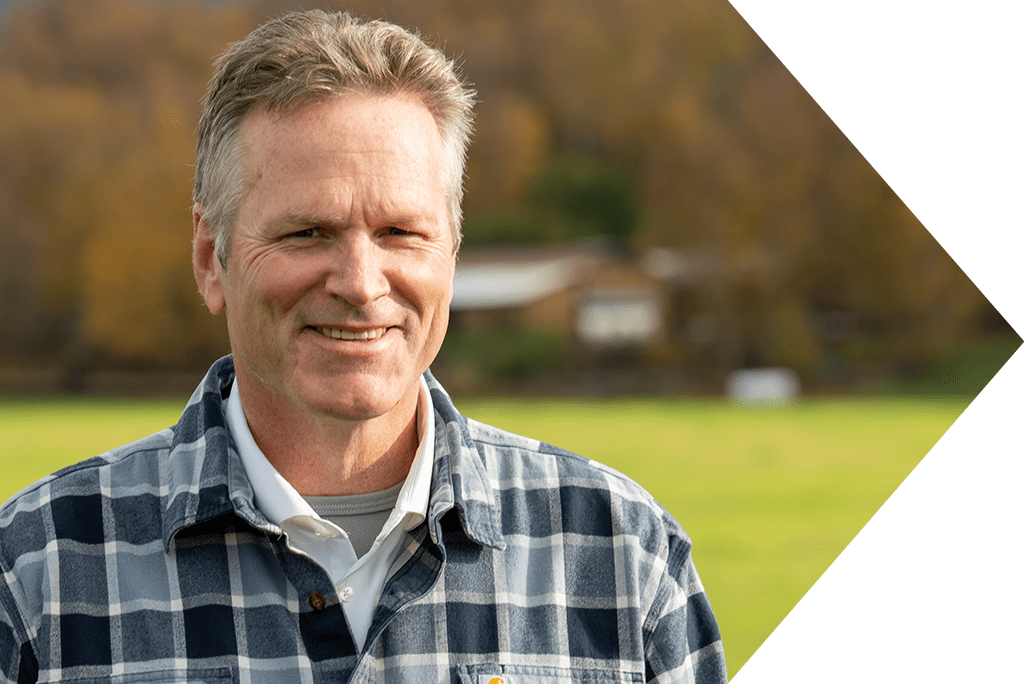 Governor Michael J. Dunleavy looking at camera outside