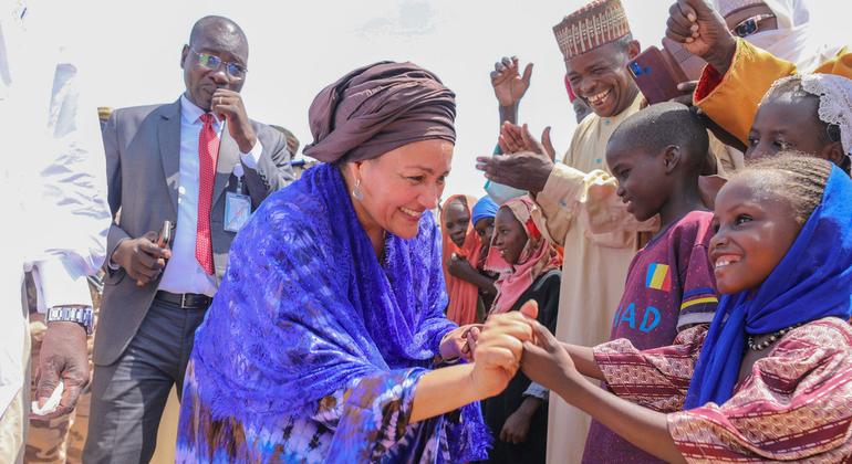 United Nations Deputy Secretary-General Amina Mohammed meets young children at a refugee camp in Chad.