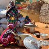 Internally displaced families gather at a temporary gathering point outside a school in El Geneina town following recent intercommunal conflict in West Darfur.