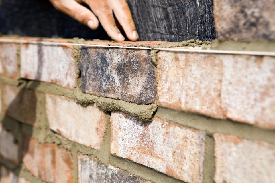 A brick wall being built