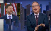 A man in a suit sits behind a talk show desk. In the top-left is an image of another man in a suit.