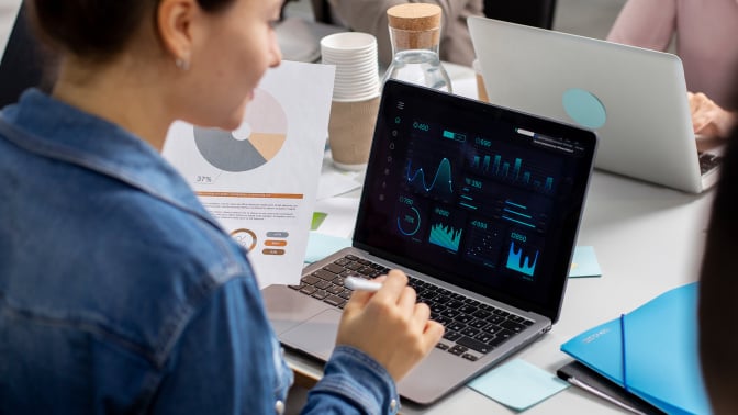 woman using laptop to view data