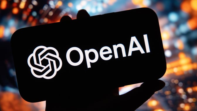 A symbol for the OpenAI virtual assistant arranged on a smartphone