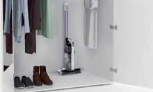 Shark Pet cordless vacuum in white closet next to shoes