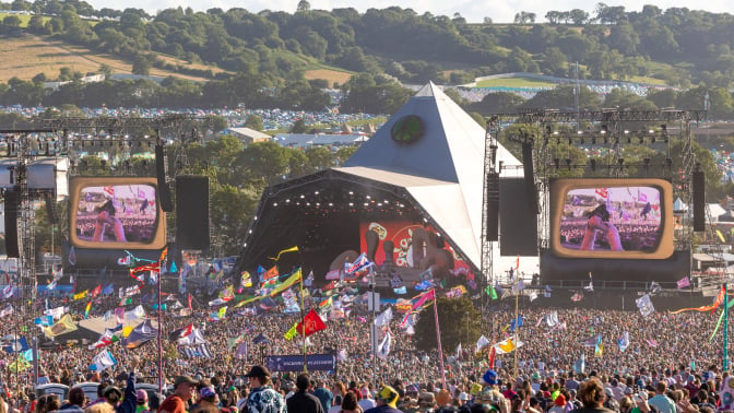 The crowd gathers to watch Elton John perform