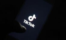 TikTok's logo displayed on a smartphone screen.