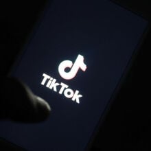 TikTok's logo displayed on a smartphone screen.