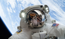 An astronaut on a spacewalk outside the International Space Station.