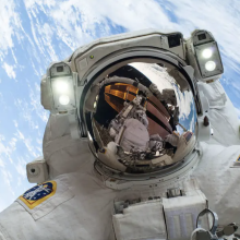 An astronaut on a spacewalk outside the International Space Station.