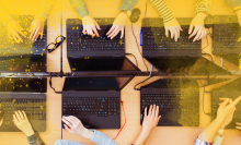 hands working on keyboards