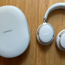 A pair of Bose QuietComfort Ultra headphones on a table