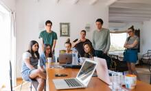 Group of people looking at laptops