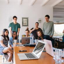 Group of people looking at laptops