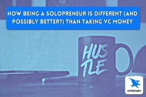 A mug that says hustle in an edgy font on a solopreneur's desk