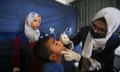 A child is vaccinated against polio in Deir al Balah, Gaza, as part of a campaign by the Palestinian health ministry in collaboration with various UN agencies