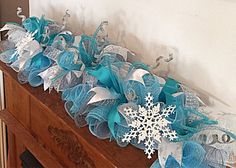 blue and white snowflake decoration on top of a dresser