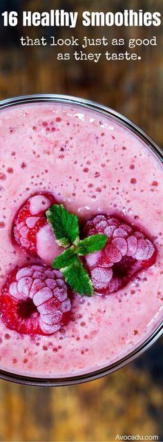 a smoothie with raspberries and mint on top is in a glass bowl that says, 16 healthy smoothies that look just as good as they taste