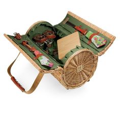 a wicker picnic basket filled with food and utensils on a white background